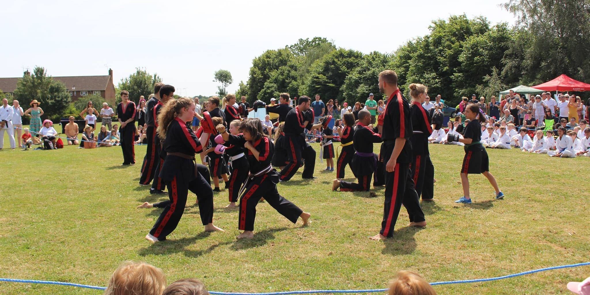 Students practising kickboxing techniques outdoors
